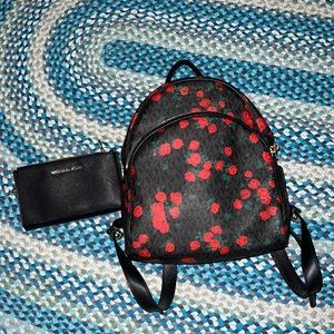 Michael Kors book bag and black wallet